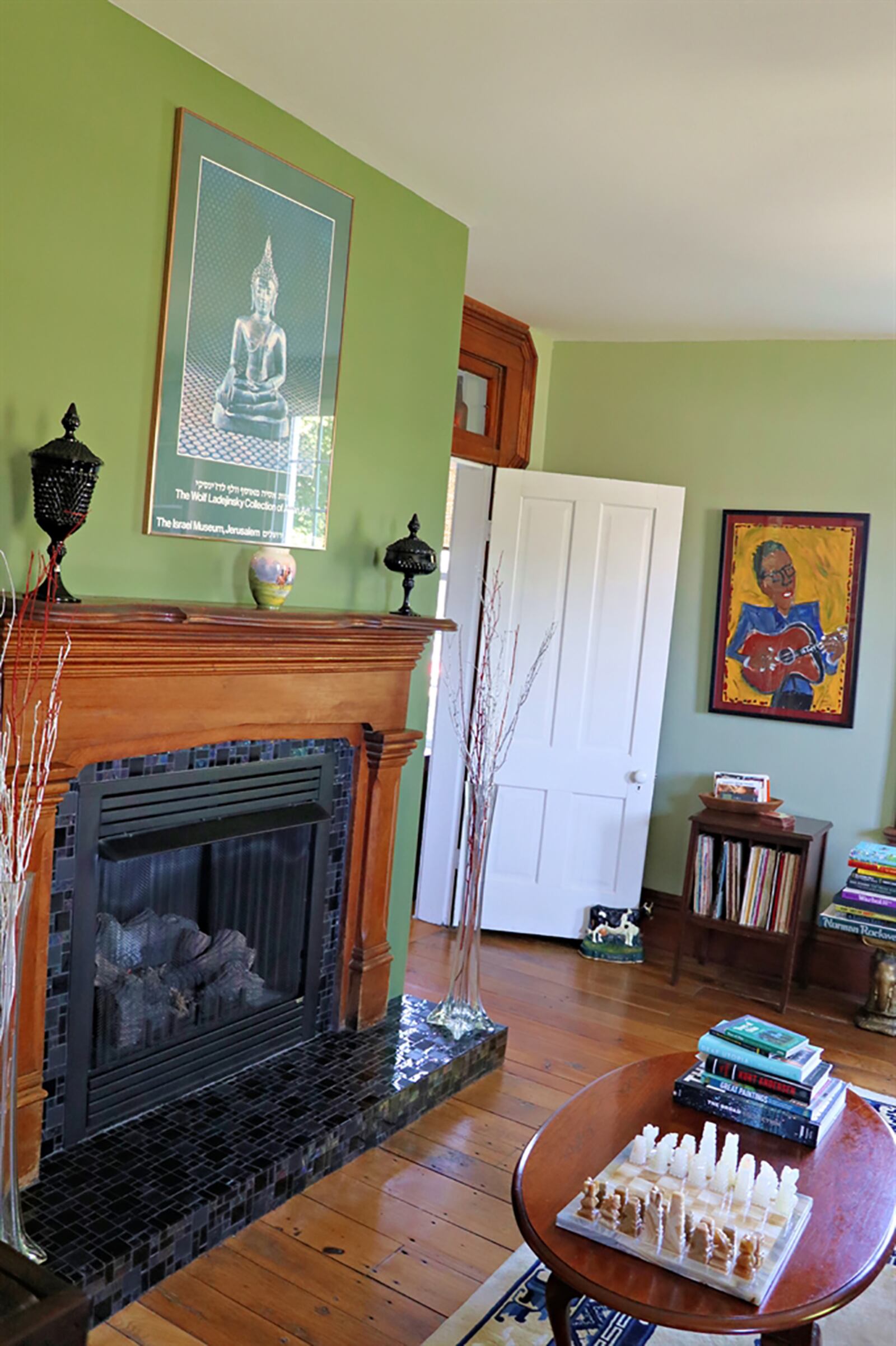 The library features a converted gas fireplace with a refinished wood mantel, an updated mosaic-tile hearth and surround. CONTRIBUTED PHOTO BY KATHY TYLER