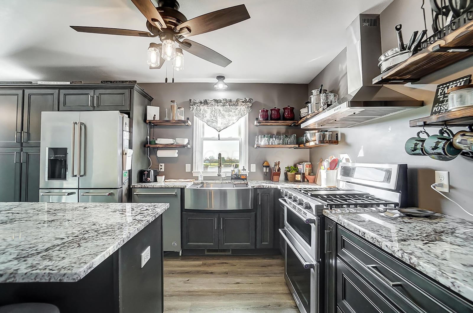 The kitchen is open to the living room and has updated stainless appliances and cabinetry.