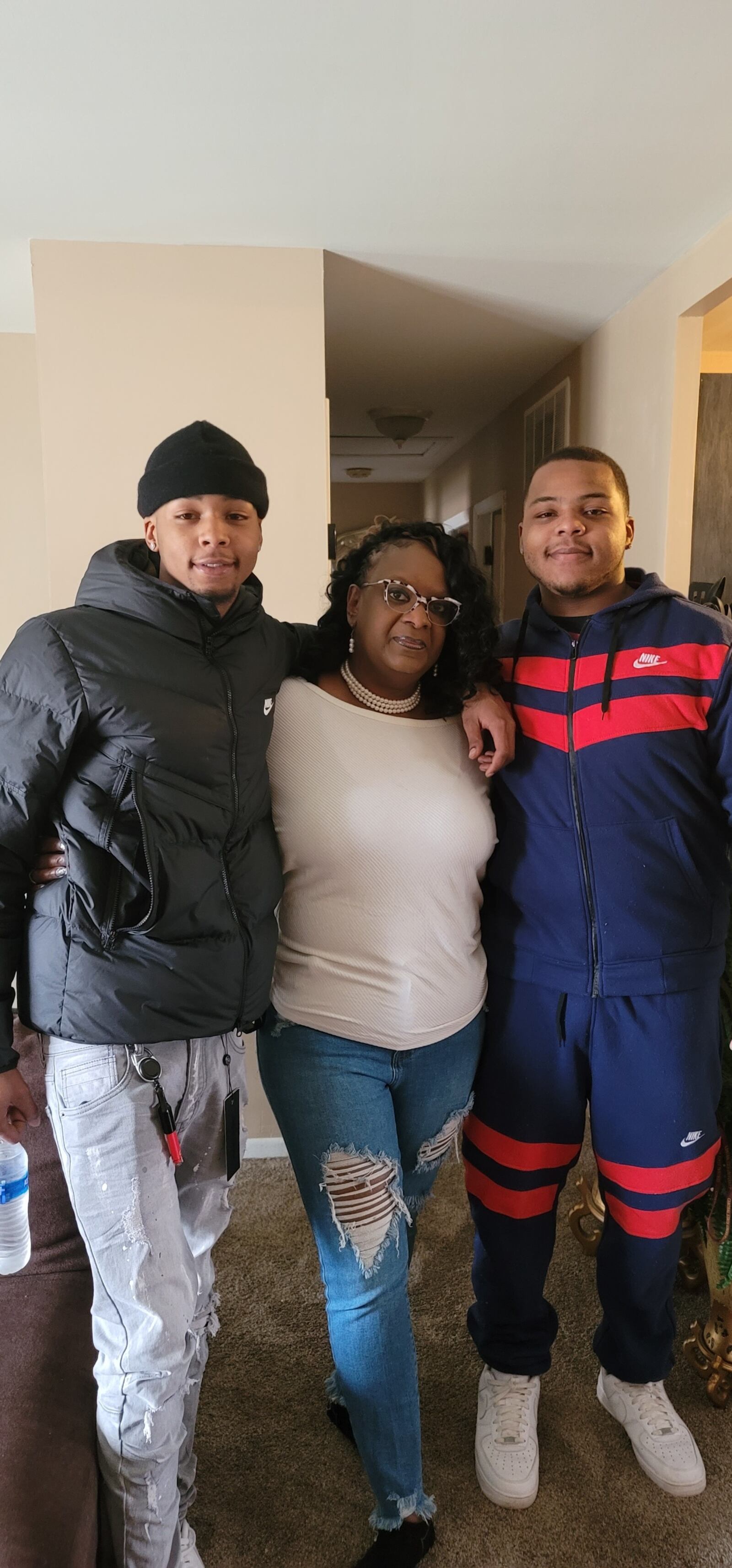 Gregory Wells Jr. (left) poses for a photo with his family. CONTRIBUTED