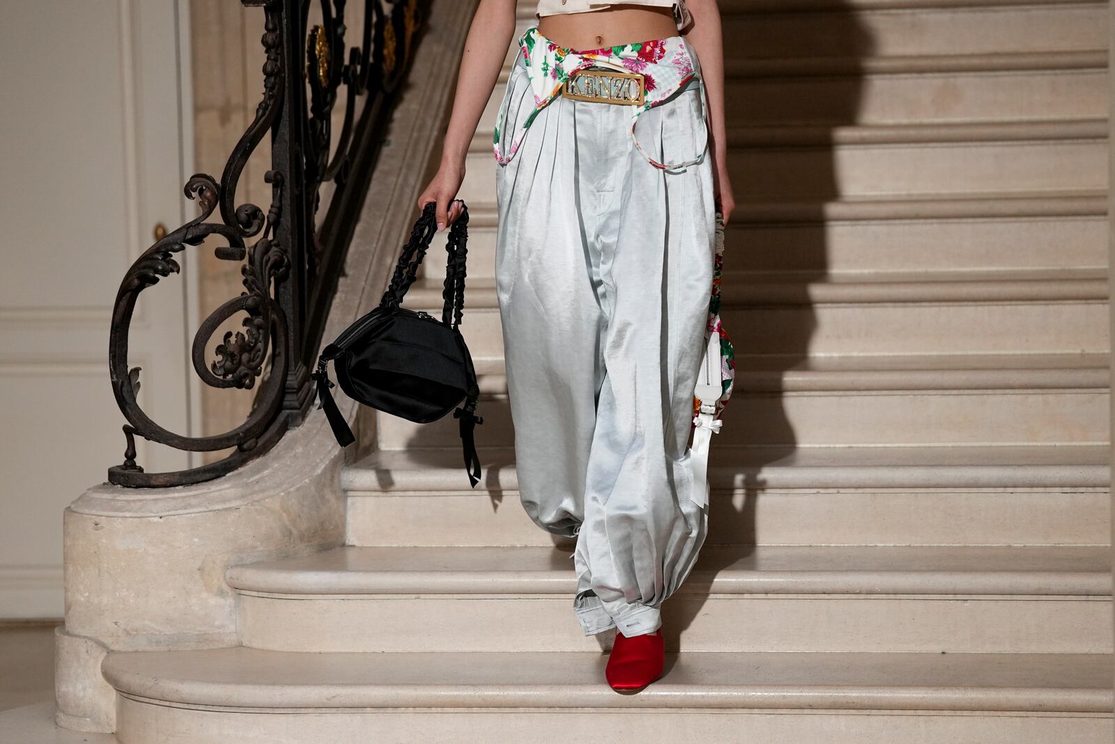 A model wears a creation as part of the Kenzo Fall/Winter 2025-2026 Womenswear collection presented in Paris, Friday, March 7, 2025. (Photo by Scott A Garfitt/Invision/AP)