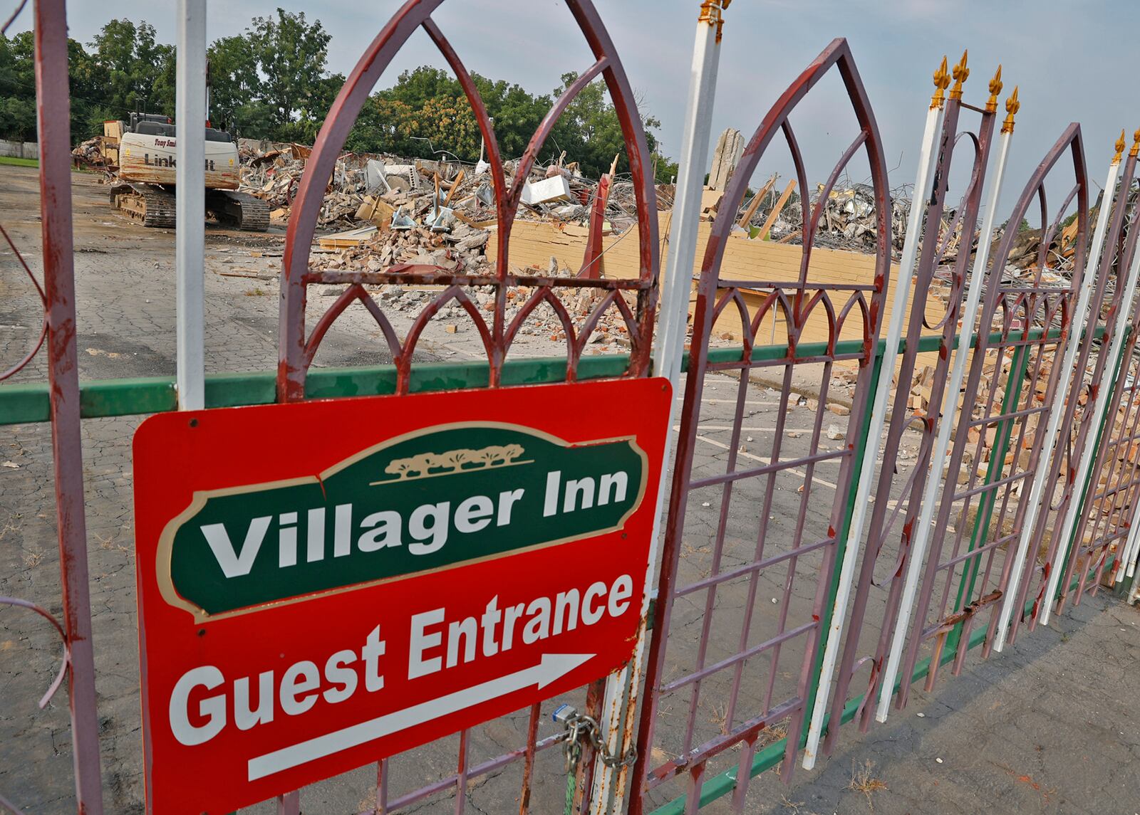 All that remains of the Villager Inn at 1715 W. North St. Monday, August 21, 2023, is the sign and a giant pile of rubble after it was demolished Saturday. BILL LACKEY/STAFF