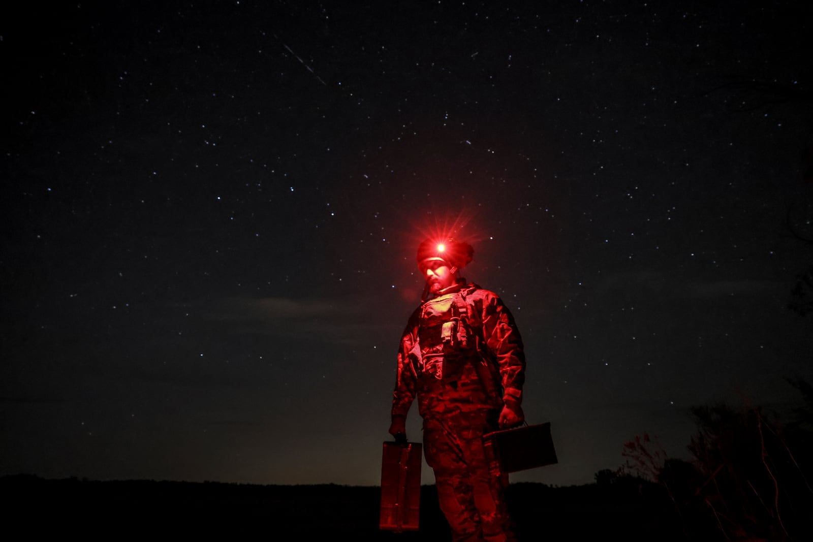 In this photo provided by Ukraine's 24th Mechanised Brigade press service, a serviceman of the 24th Mechanised Brigade approaches his position in Chasiv Yar, Donetsk region, Ukraine, Wednesday, Oct. 23, 2024. (Oleg Petrasiuk/Ukrainian 24th Mechanised Brigade via AP)