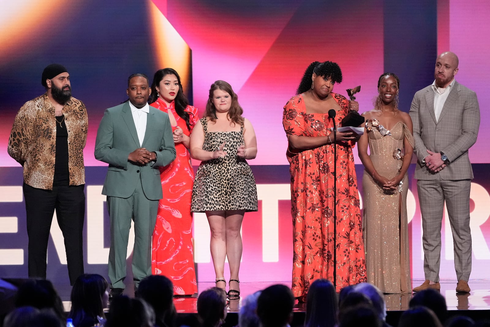 Arkie Kandola, from left, Chris Powell, Jaylee Hamidi, Michelle McLeod, Natasha Rothwell, Elle Lorraine and KeiLyn Durrel Jones accept the award for best ensemble cast in a new scripted series for "How to Die Alone" during the Film Independent Spirit Awards on Saturday, Feb. 22, 2025, in Santa Monica, Calif. (AP Photo/Chris Pizzello)