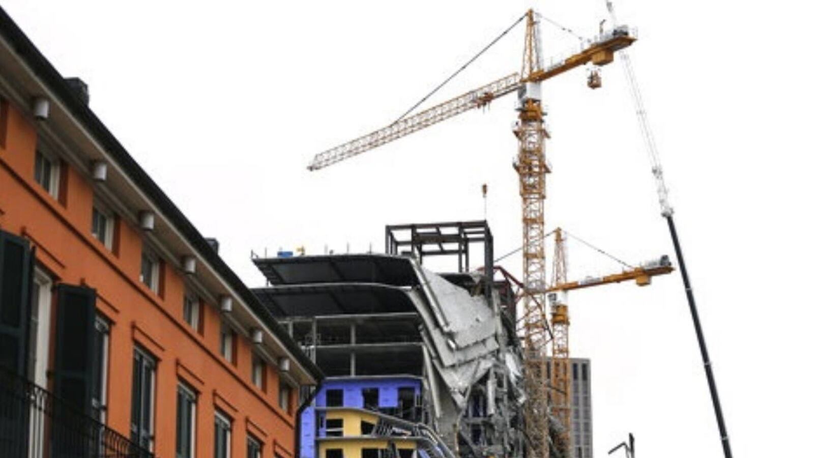 Workers began the process of preparing the two unstable cranes for implosion at the collapse site of the Hard Rock Hotel in NE Orleans.