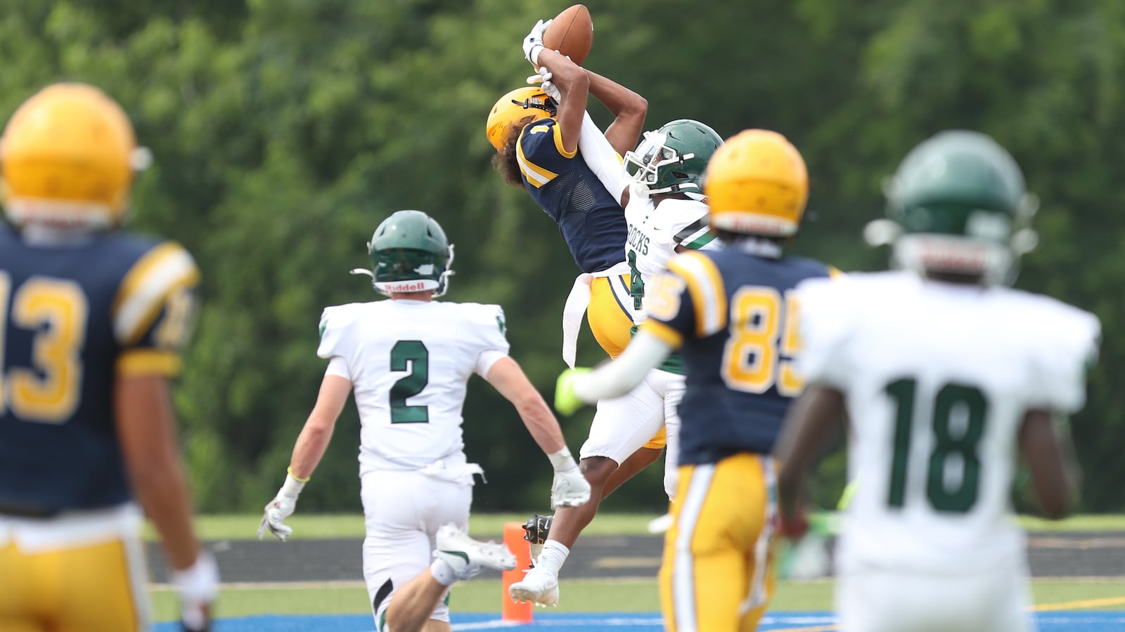 Springfield High School senior wide receiver Da'Shawn Martin leaps for a pass during their scrimmage game against Louisville Trinity on Aug. 5 in Springfield. CONTRIBUTED PHOTO BY MICHAEL COOPER