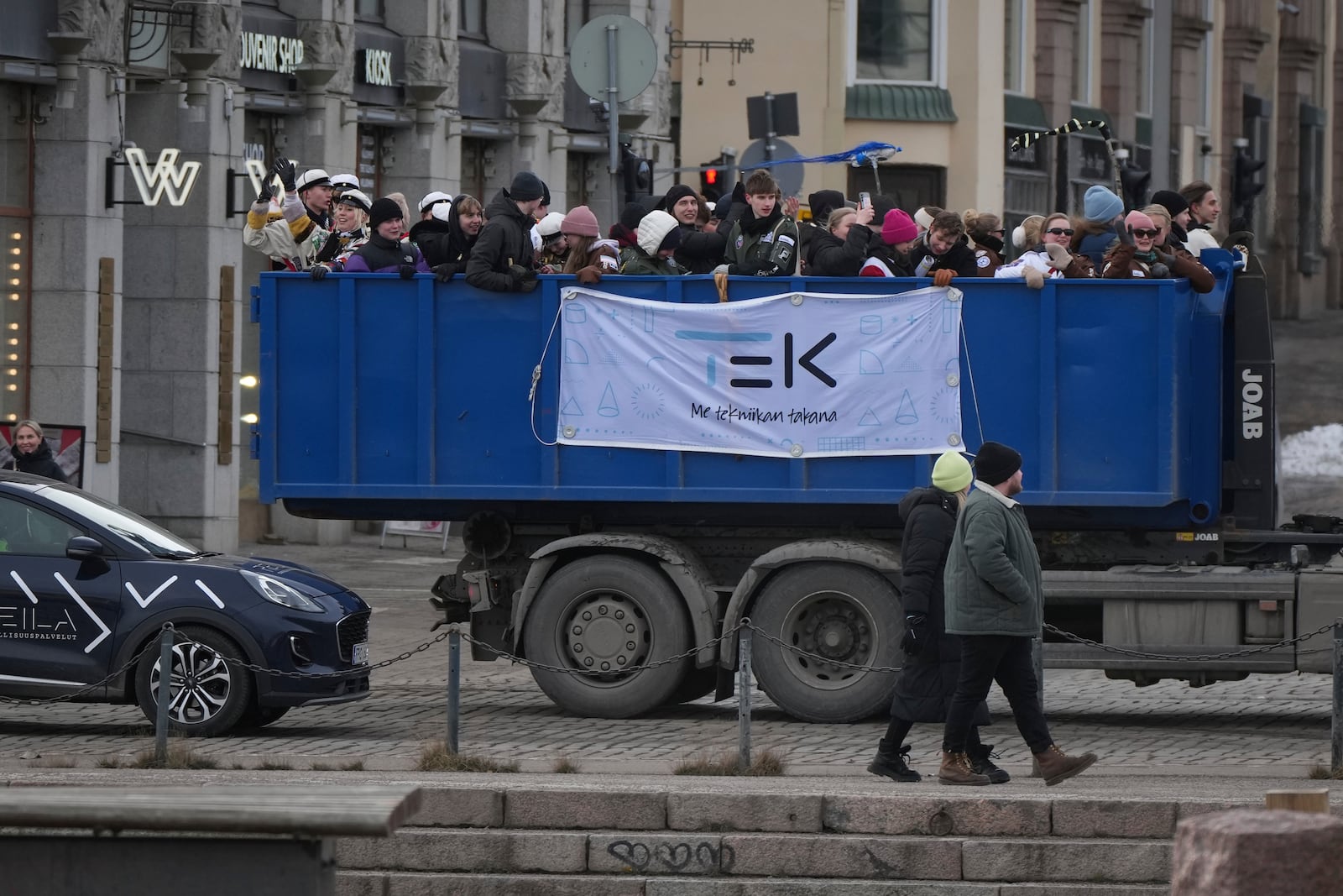 Finnish final-year high school students paraded through downtown as part of the traditional annual Penkkarit in the center of Helsinki, Finland, Saturday, March 15, 2025. (AP Photo/Sergei Grits)