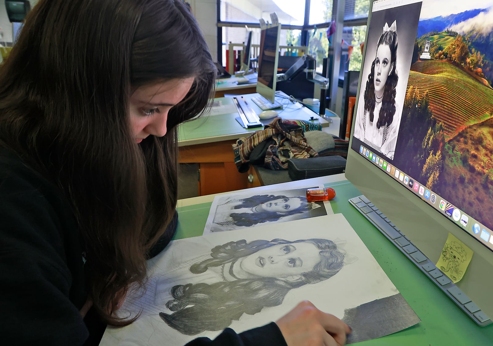 Chelsea Armes, a junior from Northeastern High School, works on a project in the Computer Graphic Arts program at the Springfield-Clark CTC. BILL LACKEY/STAFF