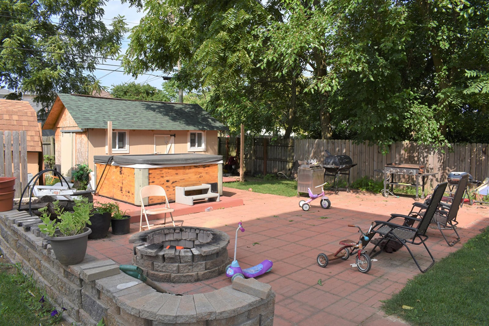 The back yard has a patio with hot tub and fire pit, and the yard is fully fenced. CONTRIBUTED PHOTO