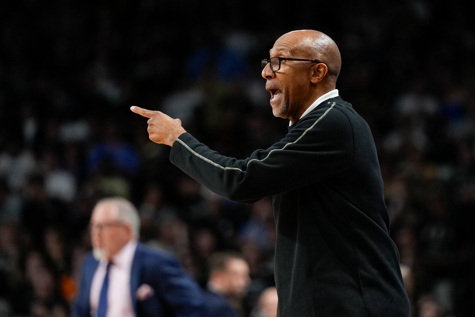 Central Florida head coach Johnny Dawkins directs players on the court during the first half of an NCAA college basketball game against Texas A&M, Monday, Nov. 4, 2024, in Orlando, Fla. (AP Photo/John Raoux)