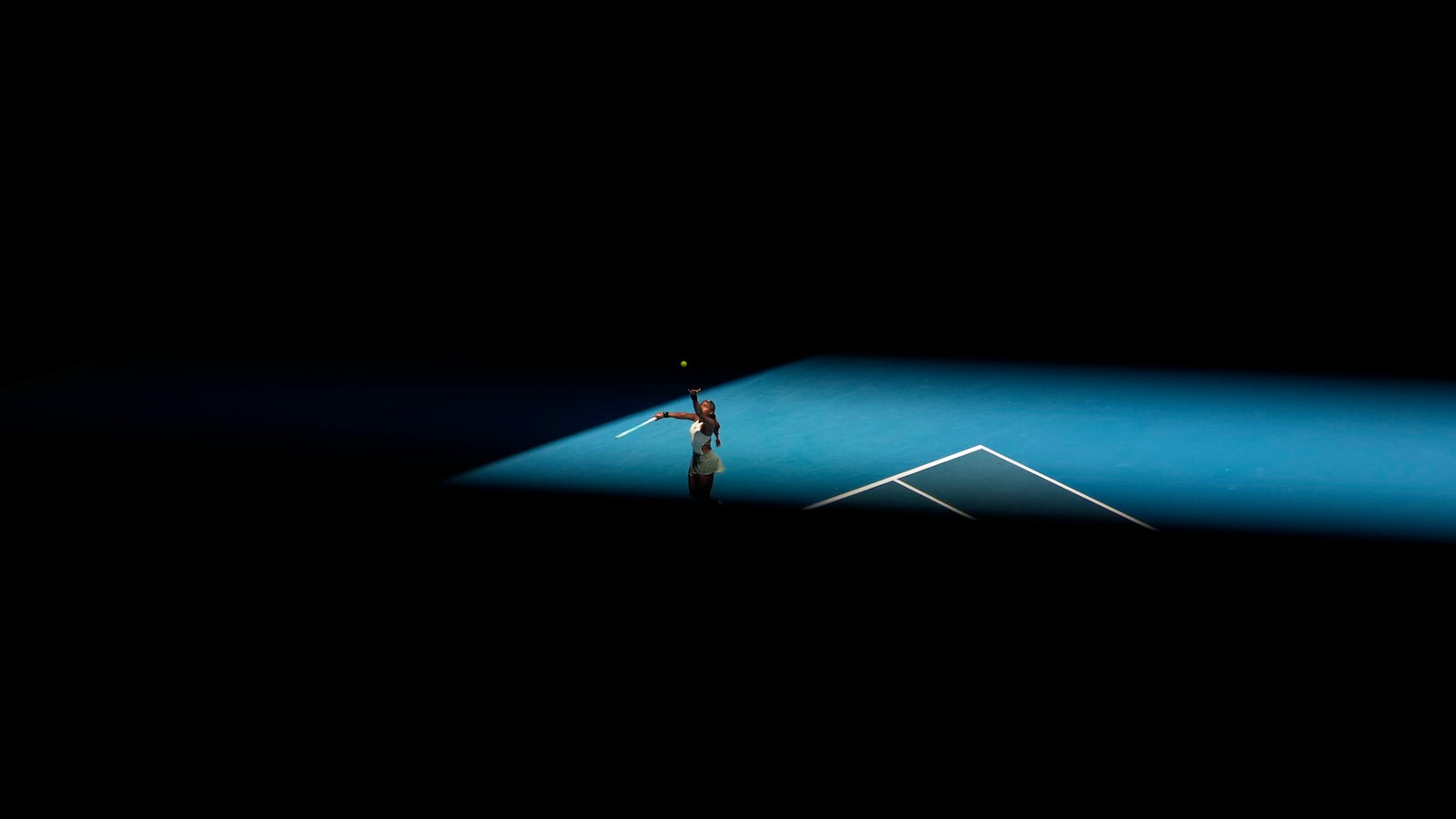 Coco Gauff of the U.S. serves to Paula Badosa of Spain during their quarterfinal match at the Australian Open tennis championship in Melbourne, Australia, Tuesday, Jan. 21, 2025. (AP Photo/Asanka Brendon Ratnayake)