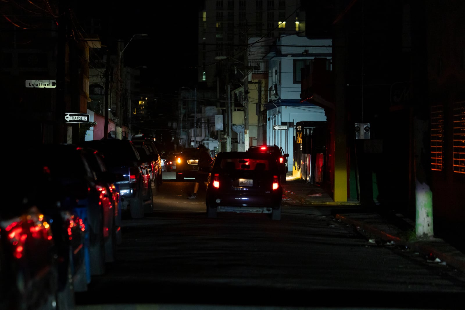 A street is dark during a blackout in San Juan, Puerto Rico, after sunset on Tuesday, Dec. 31, 2024. (AP Photo/Alejandro Granadillo)