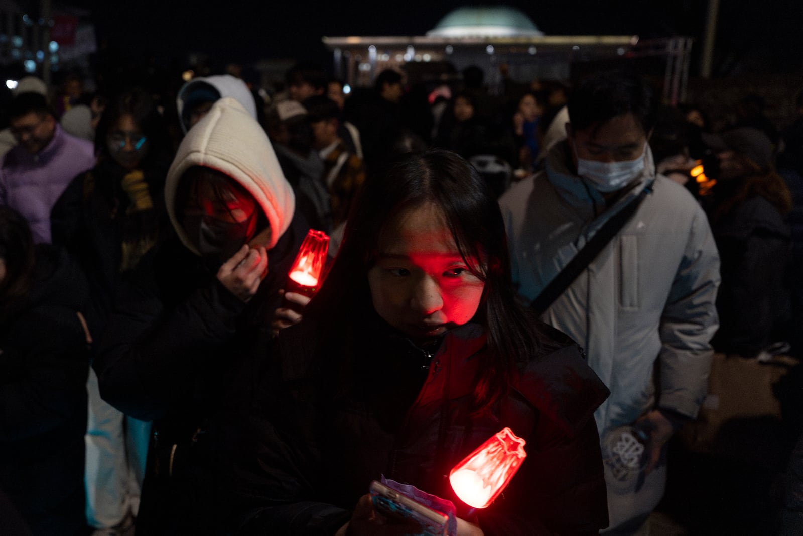 Protesters react outside the National Assembly after a failed impeachment of South Korean President Yoon Suk Yeol, following the President's short-lived martial law declaration in Seoul, South Korea, Saturday, Dec. 7, 2024. (AP Photo/Ng Han Guan)