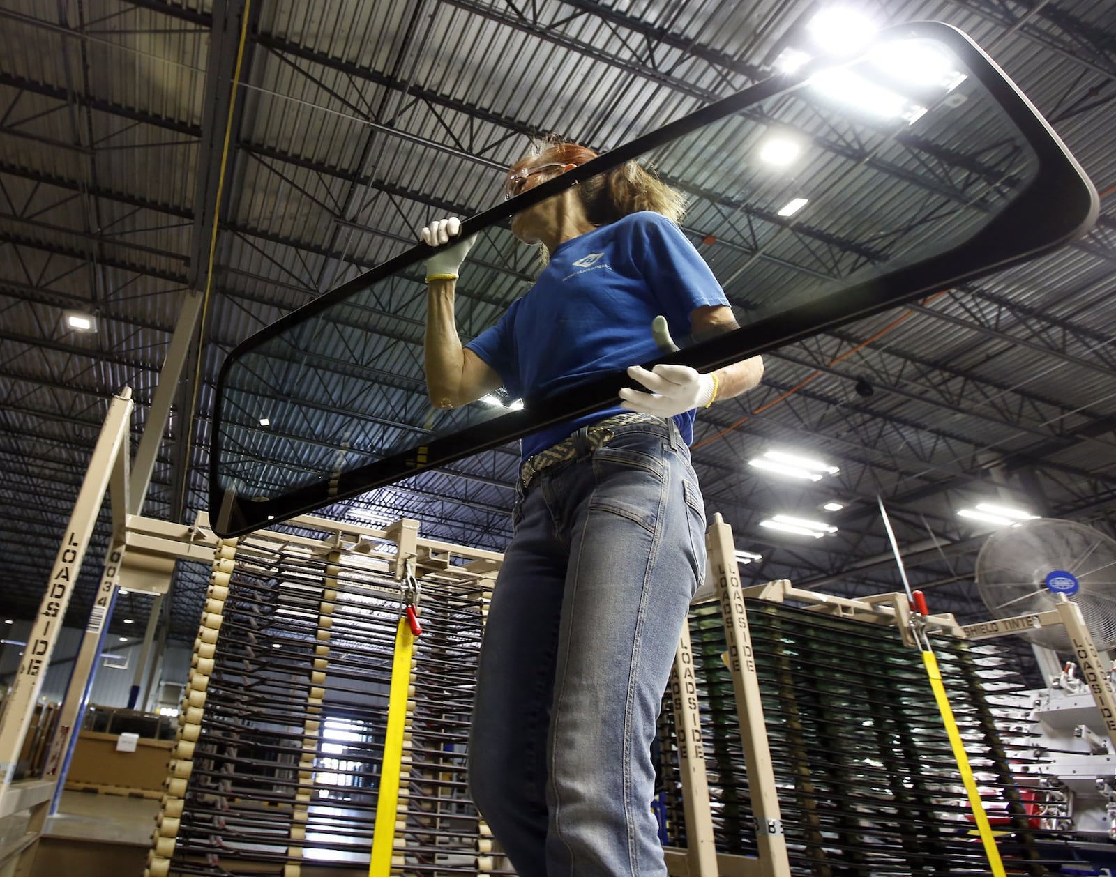 Alisa Davis at Fuyao Glass America finish moves an automobile windshield in the Moraine plant after it was inspected. The plant occupies the former site of the General Motors plant that closed in The Great Recession. Candidates for Ohio governor each have proposals they say will create more jobs at companies across the state. TY GREENLEES / STAFF