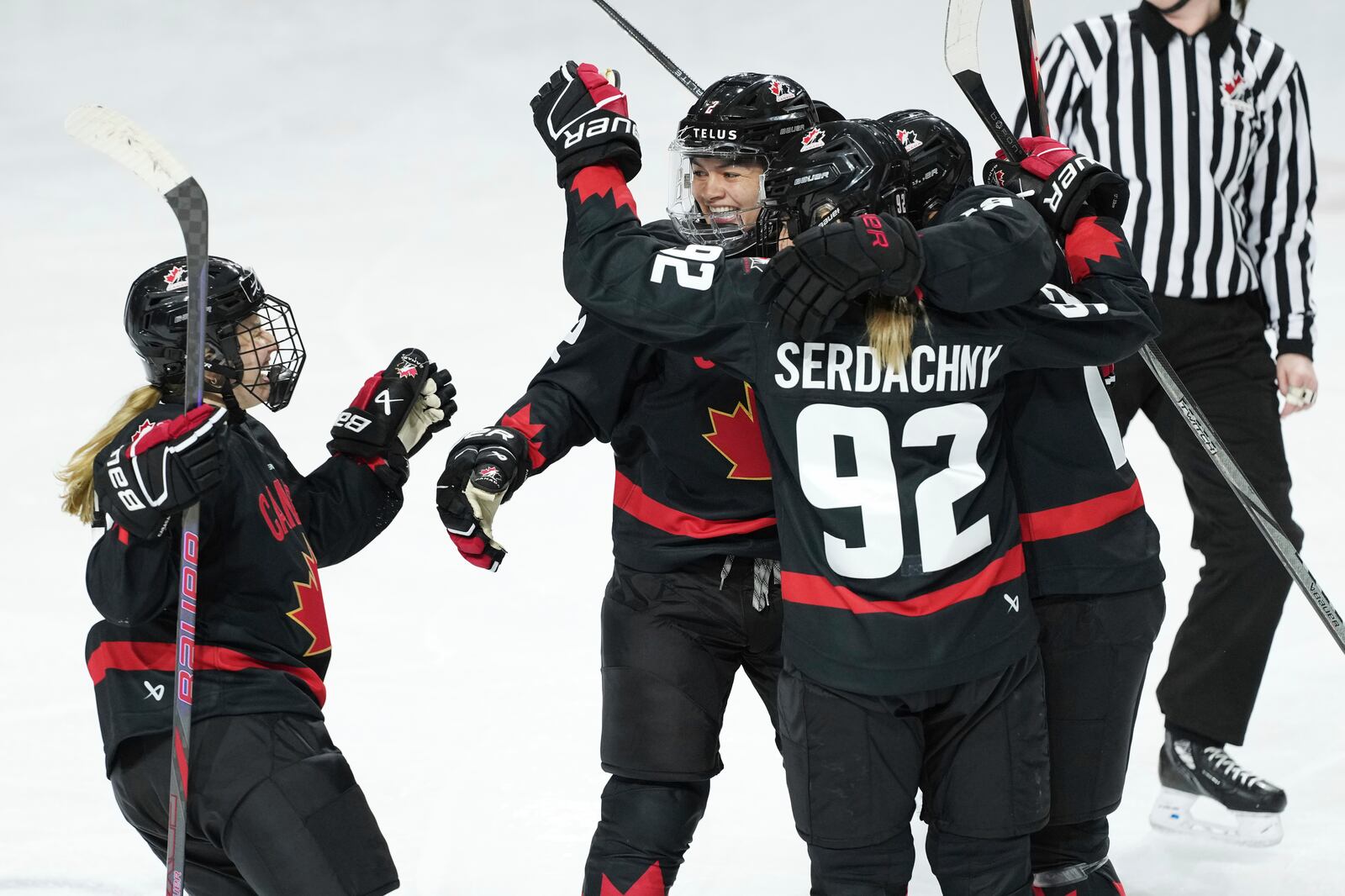 Members of Team Canada celebrate a goal against the United States during the second period of a Rivalry Series hockey game in Summerside, Prince Edward Island, Canada, Saturday, Feb. 8, 2025. (Darren Calabrese/The Canadian Press via AP)