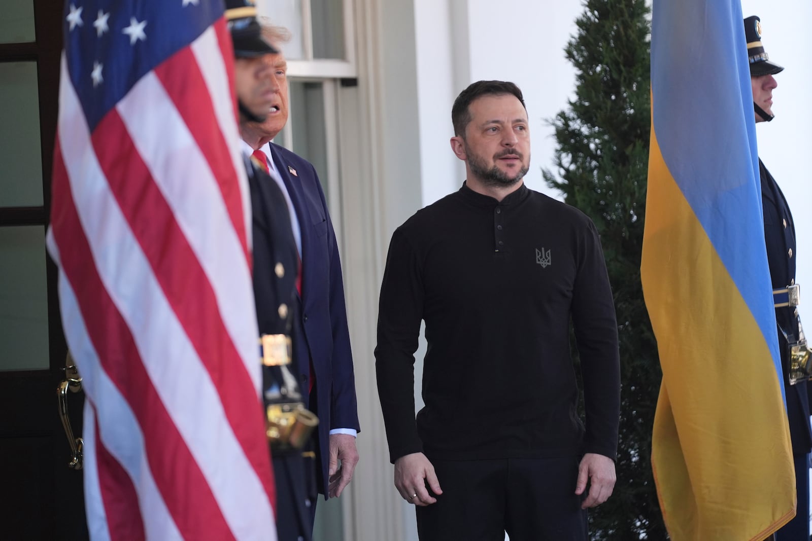 President Donald Trump, center, greets Ukrainian President Volodymyr Zelenskyy, right, at the White House, Friday, Feb. 28, 2025, in Washington. (AP Photo/Evan Vucci)