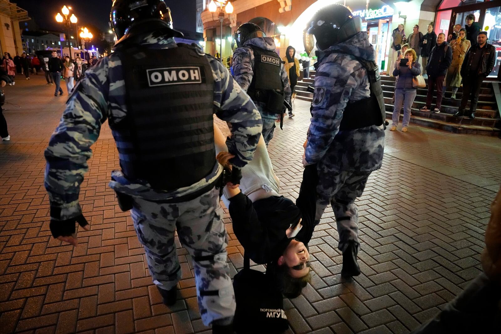 FILE - Riot police detain a demonstrator during a protest of the mobilization of reservists for fighting in Ukraine, in Moscow, Sept. 21, 2022. (AP Photo, File)