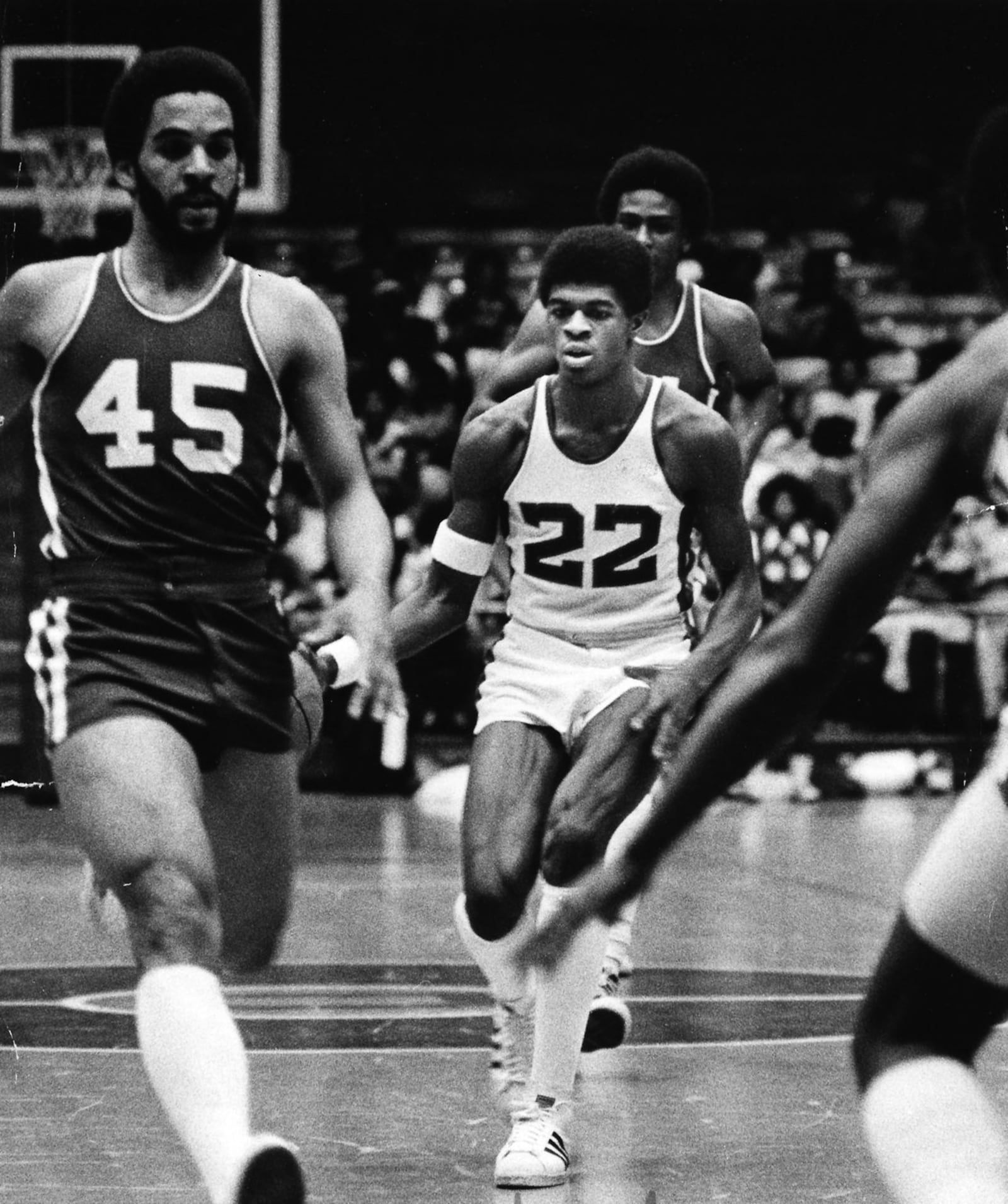 Dwight Anderson, #22, Roth HS, drives through traffic last against Dunbar back in 1978.