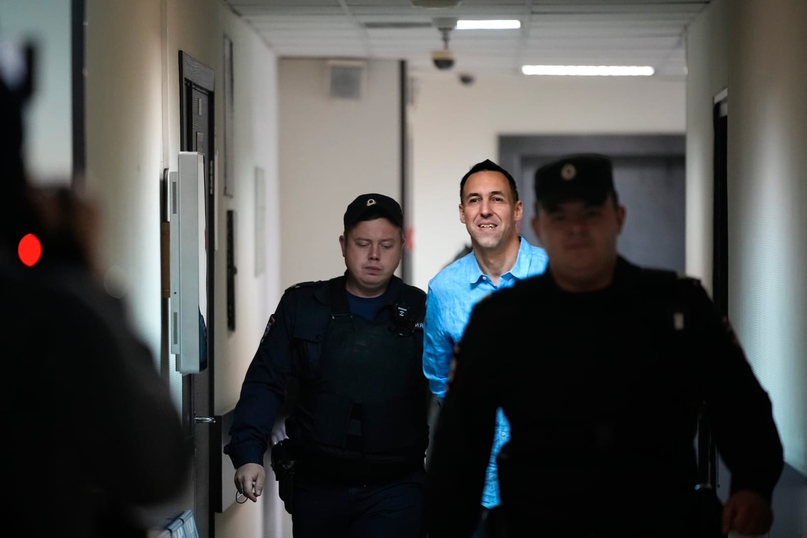 French citizen Laurent Vinatier is escorted to a court room at the Zamoskvoretsky District Court in Moscow, Russia, on Monday, Oct. 14, 2024. (AP Photo/Pavel Bednyakov)