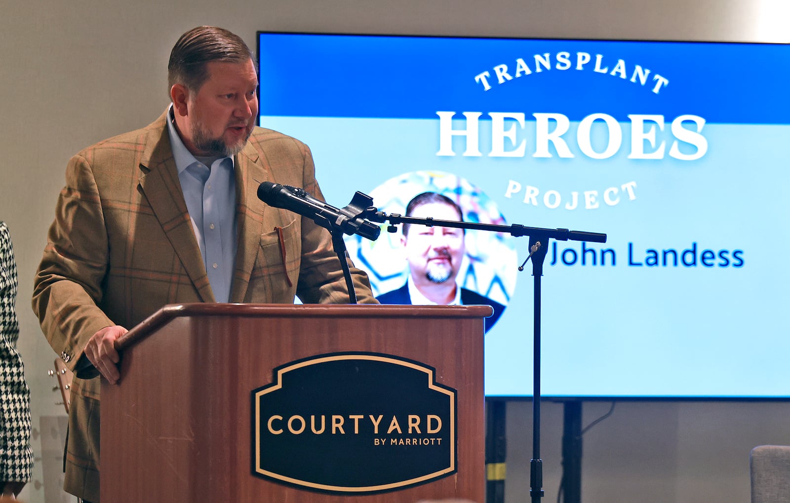 John Landess speaks during the Mayor's Breakfast after being honored as a Transplant Hero Thursday, Nov. 21, 2024. BILL LACKEY/STAFF