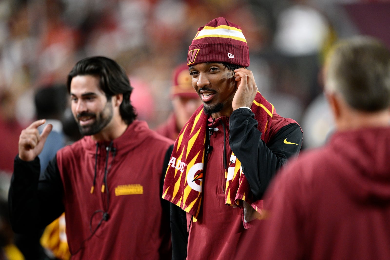 Washington Commanders quarterback Jayden Daniels stands on the sideline during the second half of an NFL football game against the Carolina Panthers, Sunday, Oct. 20, 2024, in Landover, Md. (AP Photo/Nick Wass)