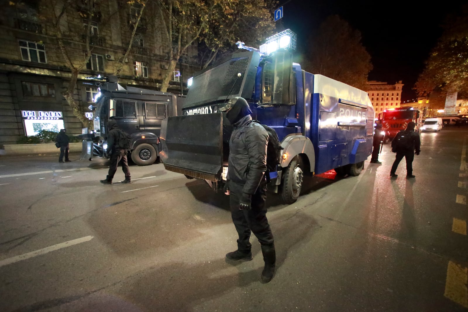 Police patrol outside the parliament's building where protesters gather to protest the government's decision to suspend negotiations on joining the European Union for four years in Tbilisi, Georgia, on Friday, Nov. 29, 2024. (AP Photo/Zurab Tsertsvadze)