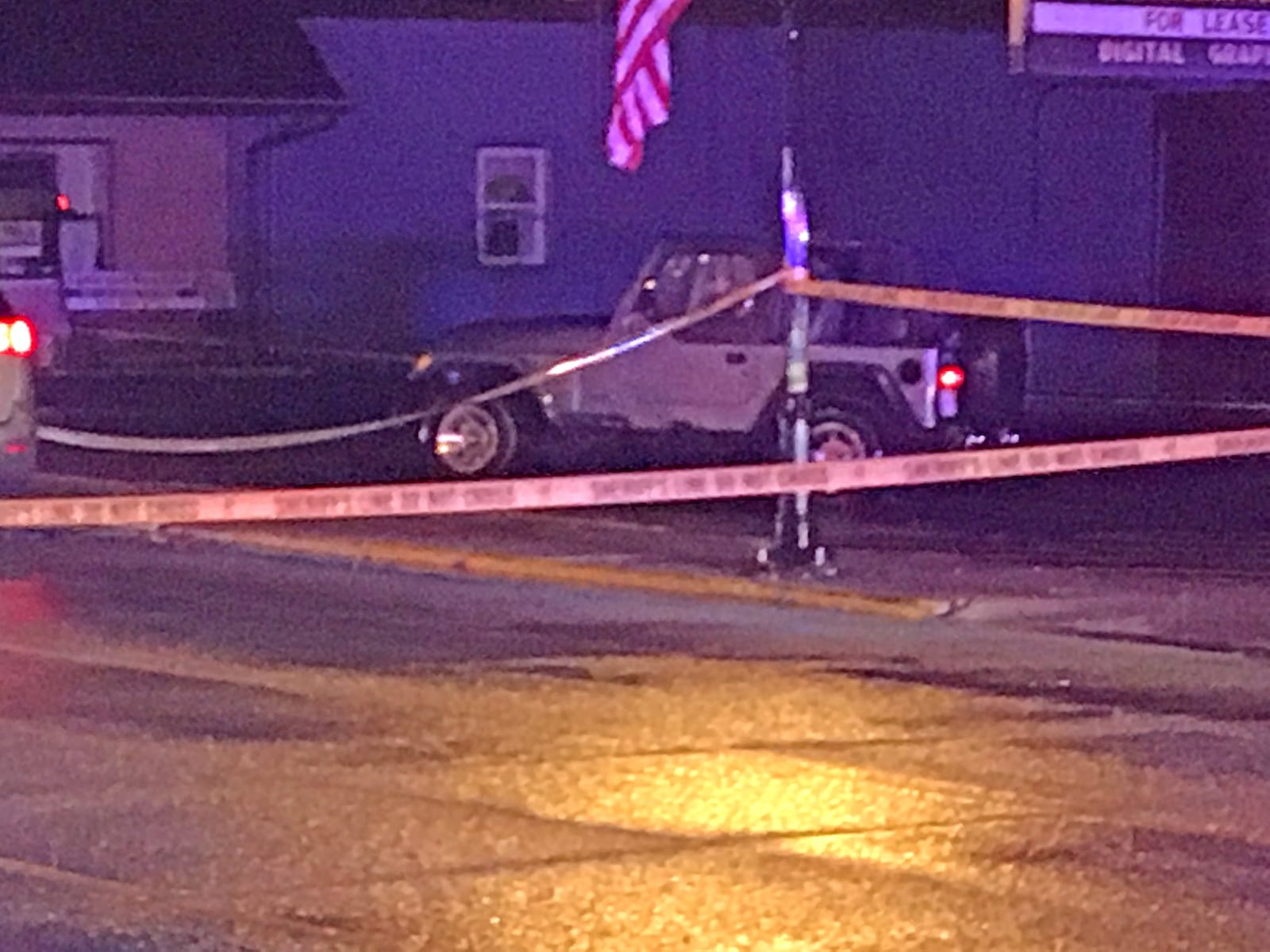 The Clark County Sheriff’s department investigate the scene along Main Street in New Carlisle where Andy Grimm, the photographer for the New Carlisle newspaper, was shot by a deputy Monday evening. James Buechele/Staff