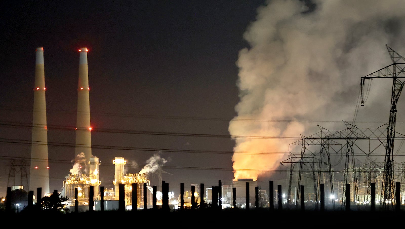 Flames and smoke from a fire fill the sky at the Moss Landing Power Plant Thursday Jan. 16, 2025 in Moss Landing, Calif. (Shmuel Thaler /The Santa Cruz Sentinel via AP)