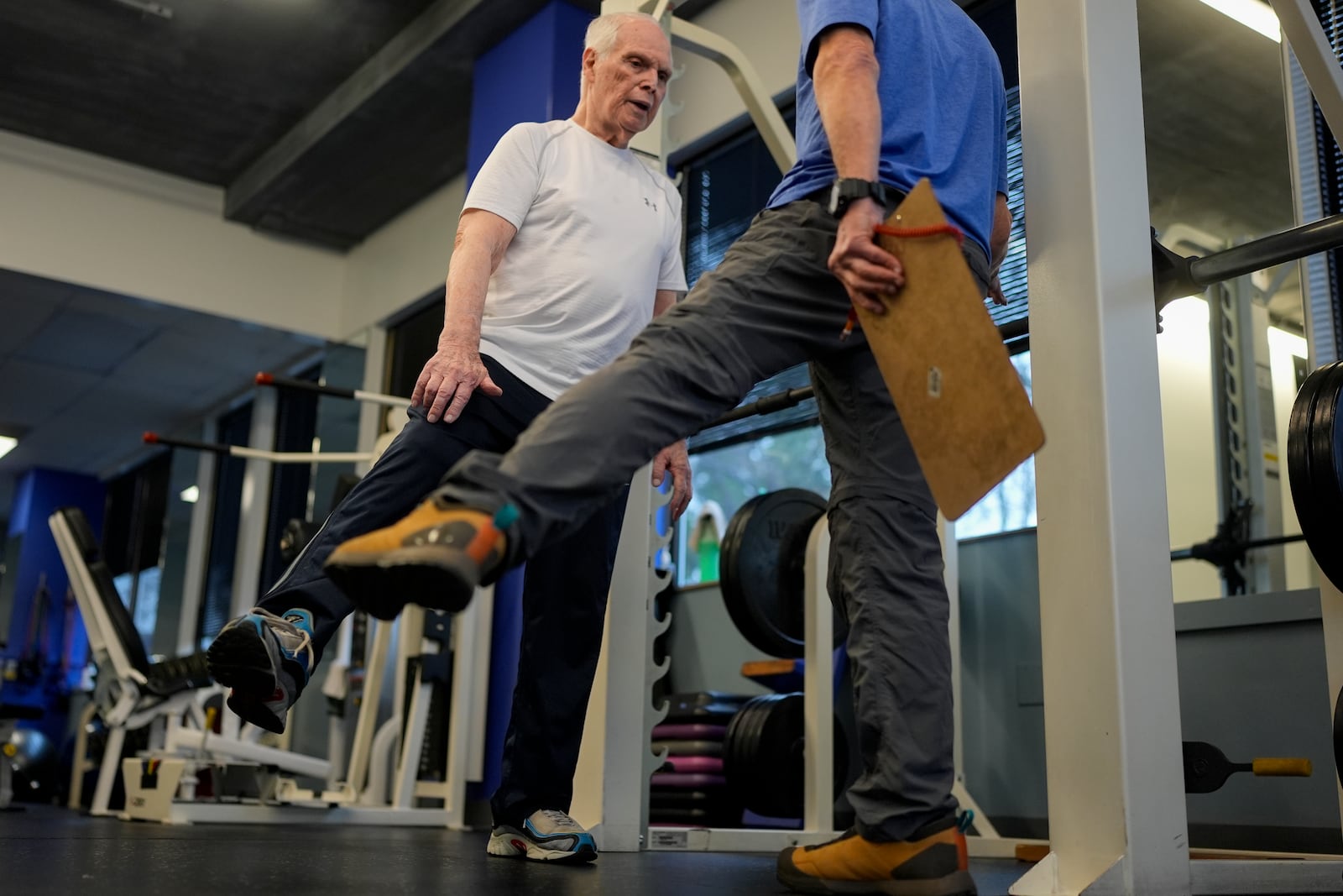 Dr. Grover Smith, left, works out with exercise scientist Dr. Irv Rubenstein, right, at STEPS Fitness, Wednesday, Feb. 12, 2025, in Nashville, Tenn. (AP Photo/George Walker IV)