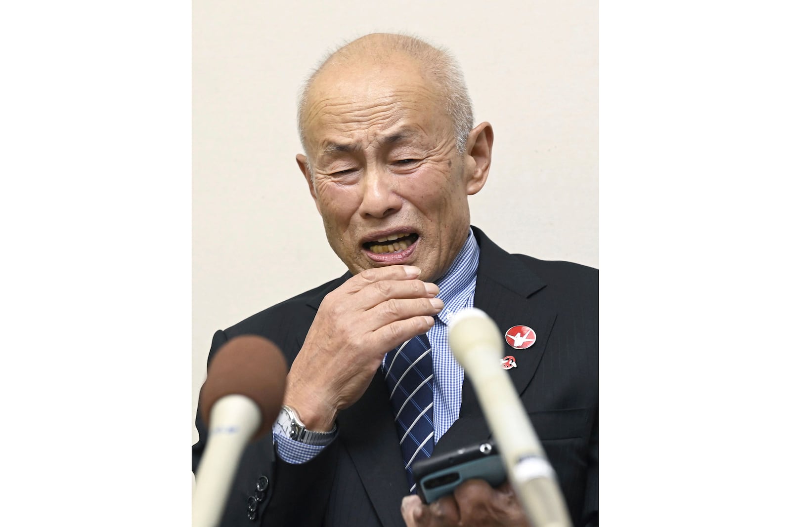 Toshiyuki Mimaki, president of Nihon Hidankyo, or the Japan Confederation of A- and H-Bomb Sufferers Organizations, reacts as he speaks to media members in Hiroshima, western Japan, Friday, Oct. 11, 2024, following Nihon Hidankyo's winning the Nobel Peace Prize. (Moe Sasaki/Kyodo News via AP)