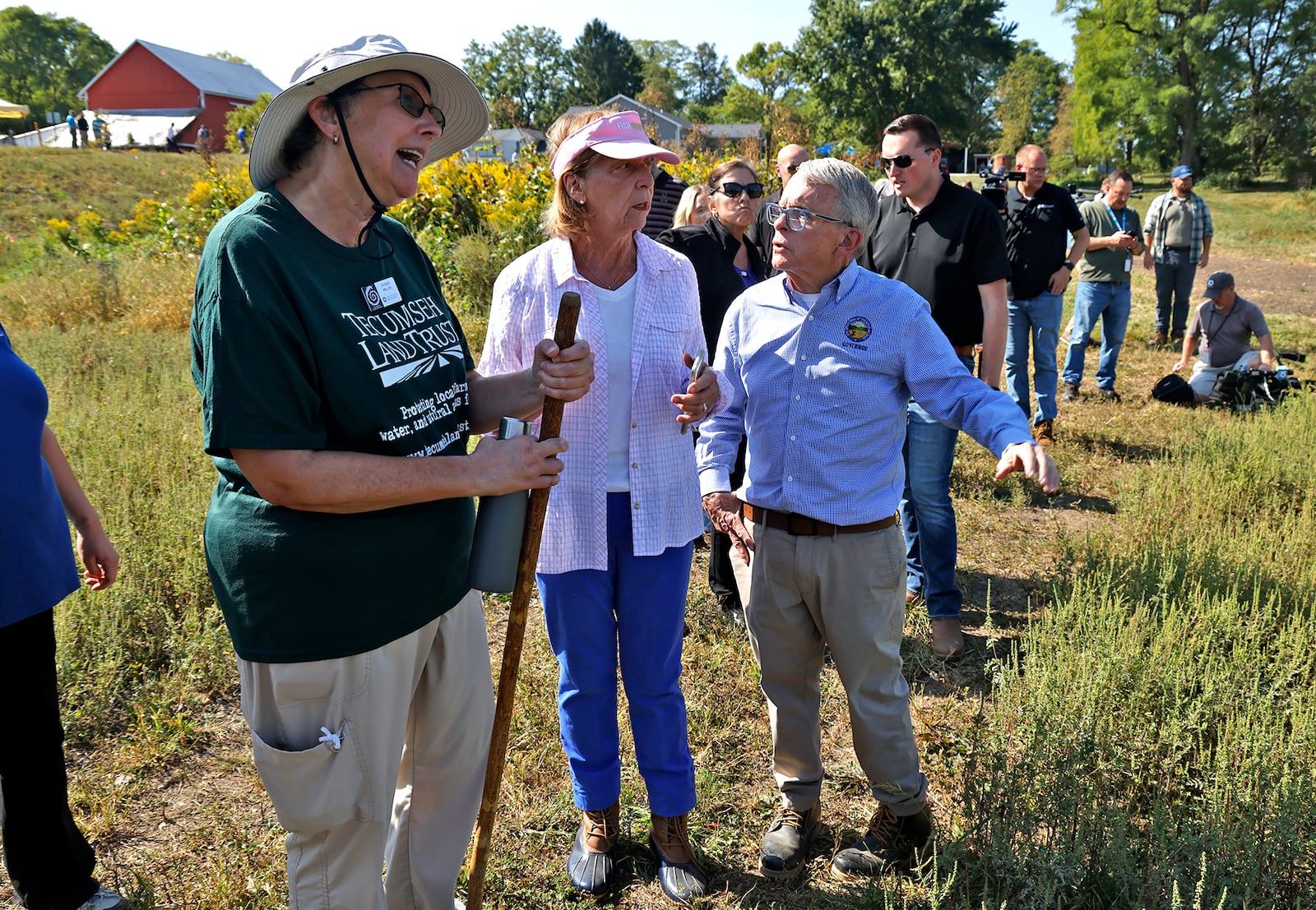 Gov. Mike DeWine and his wife, Fran, talk with Susan Miller, one of the owners of the land that was donated for the H2Ohio Rainbow Run Wetland on Old Clifton Road in Clark County Wednesday, Sept. 11, 2024. A ribbon cutting ceremony and dedication was held for the Tecumseh Land Trust wetland. BILL LACKEY/STAFF