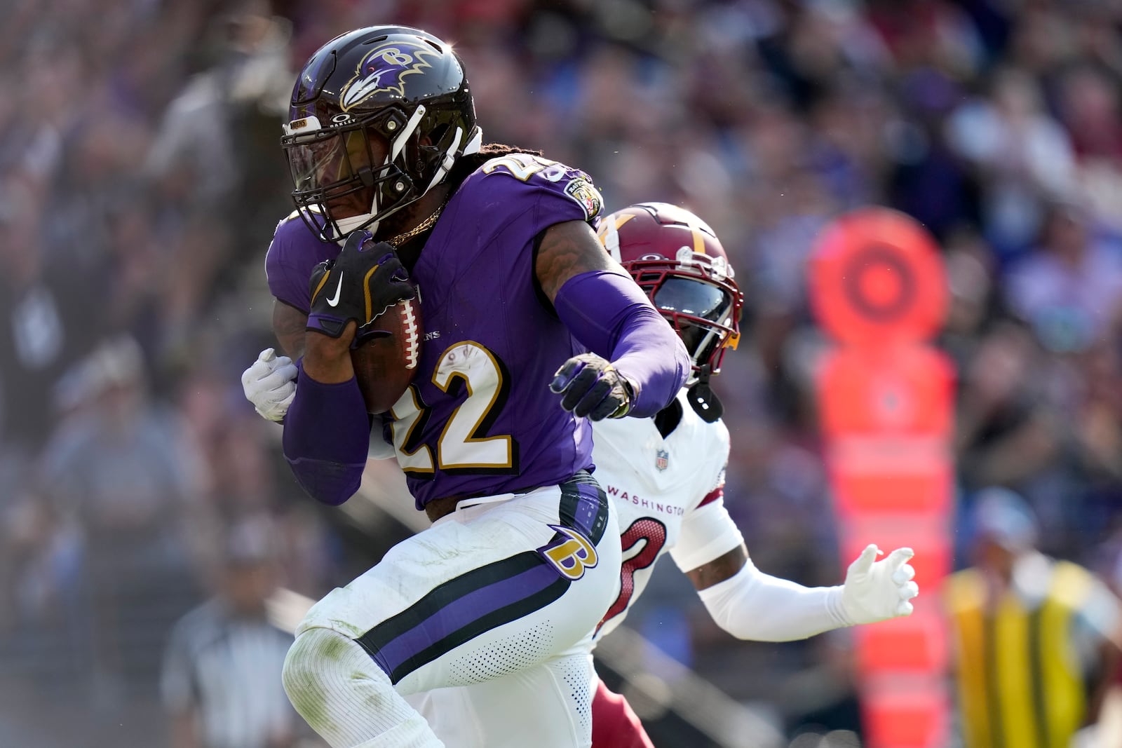 Baltimore Ravens running back Derrick Henry (22) scores on a touchdown run during the second half of an NFL football game against the Washington Commanders Sunday, Oct. 13, 2024, in Baltimore. (AP Photo/Stephanie Scarbrough)