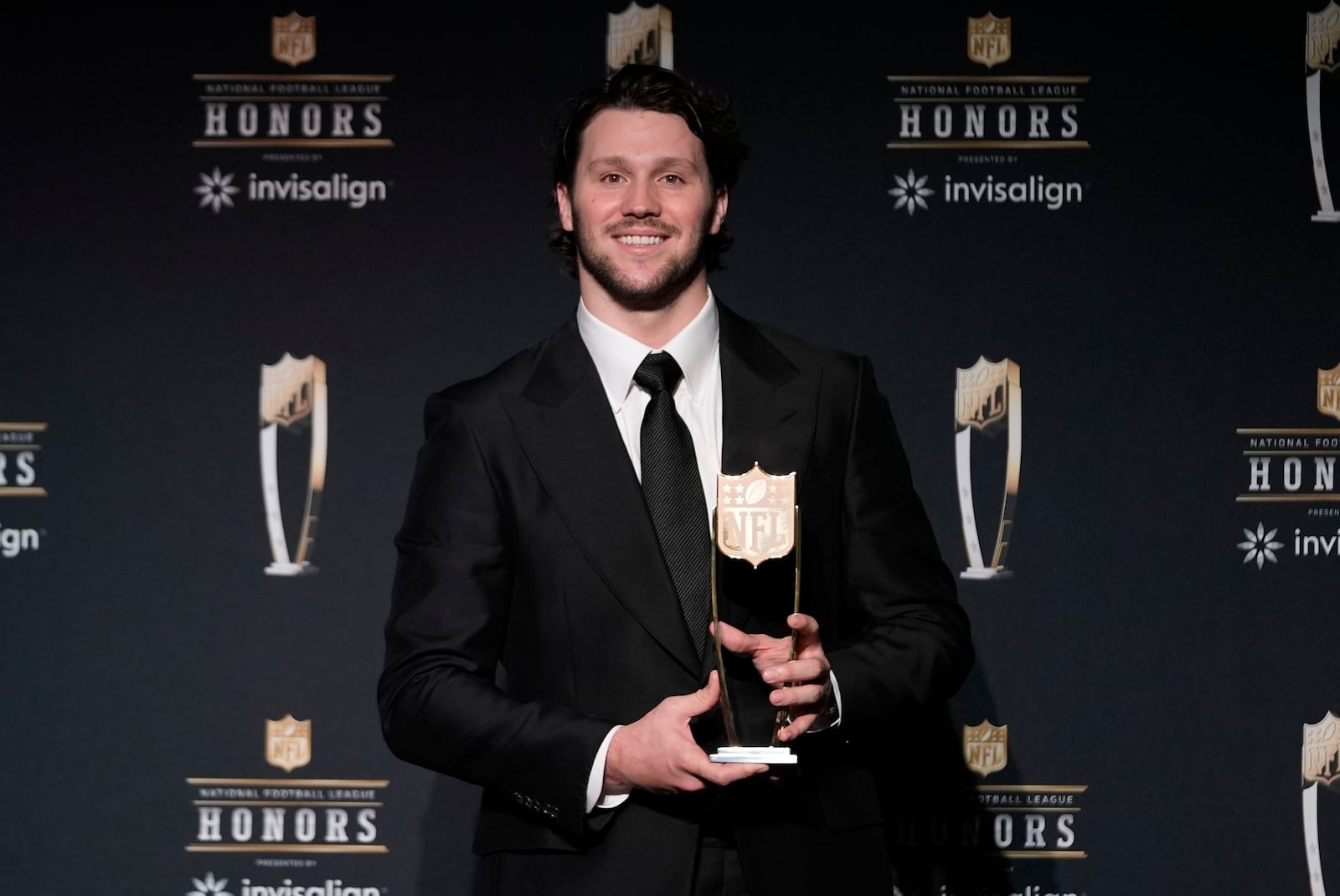 Buffalo Bills quarterback Josh Allen poses with the AP Most Valuable Player award at the NFL Honors award show ahead of the Super Bowl 59 football game, Thursday, Feb. 6, 2025, in New Orleans. (AP Photo/Gerald Herbert)