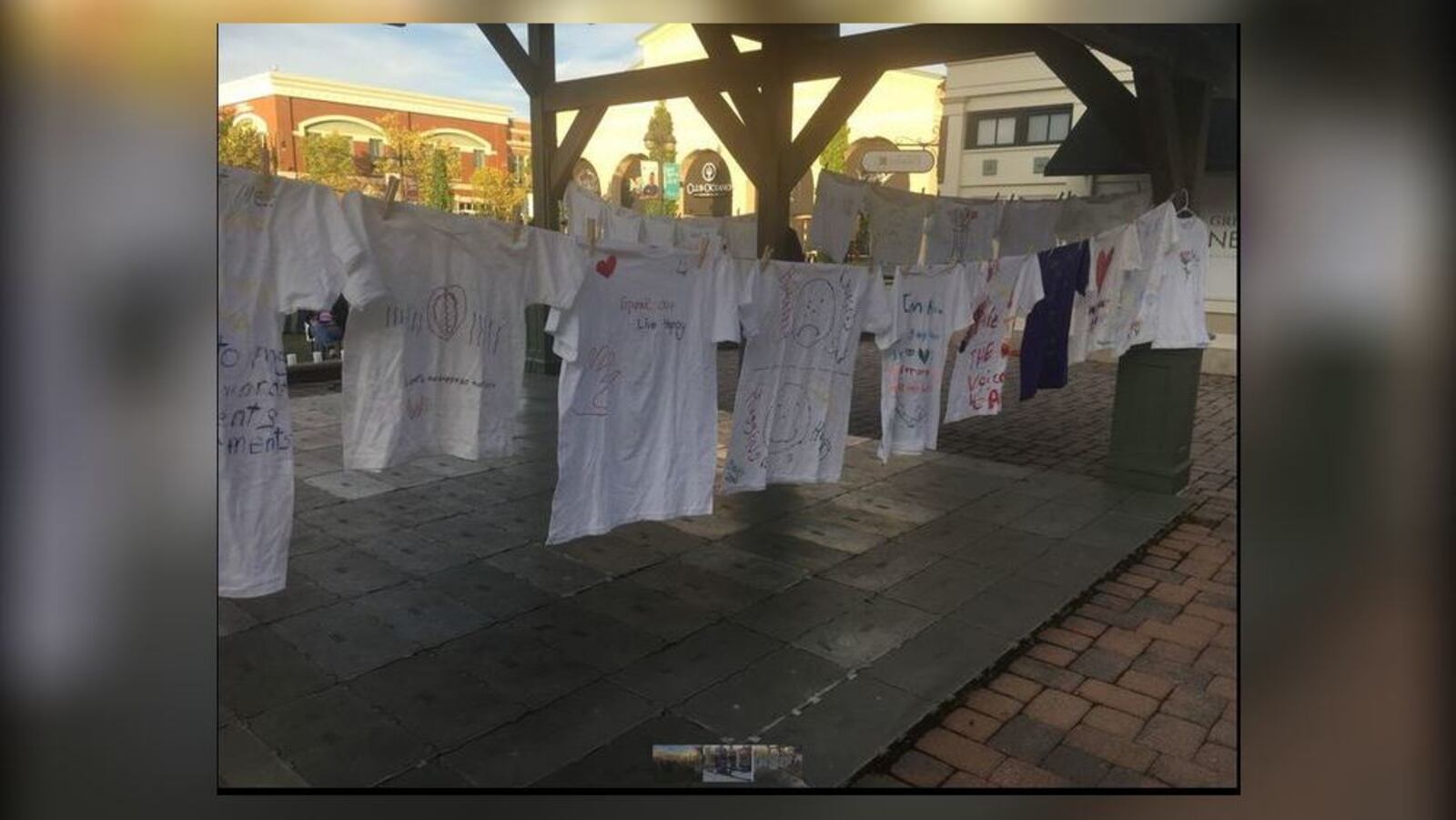 The Clothesline Project was part of the vigil at The Greene on Monday night against domestic violence. (Steve Maguire/Staff)