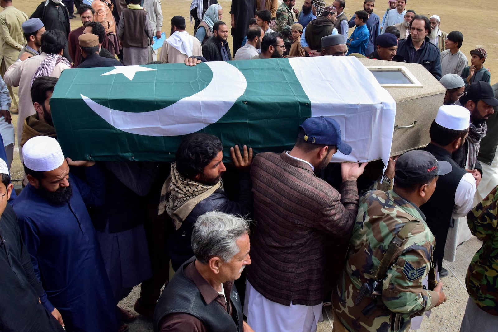 Mourners carry the coffin of a victim of the train attack, for a funeral prayer in Quetta, Pakistan's southwestern Balochistan province, Thursday March 13, 2025. (AP Photo/Arshad Butt)