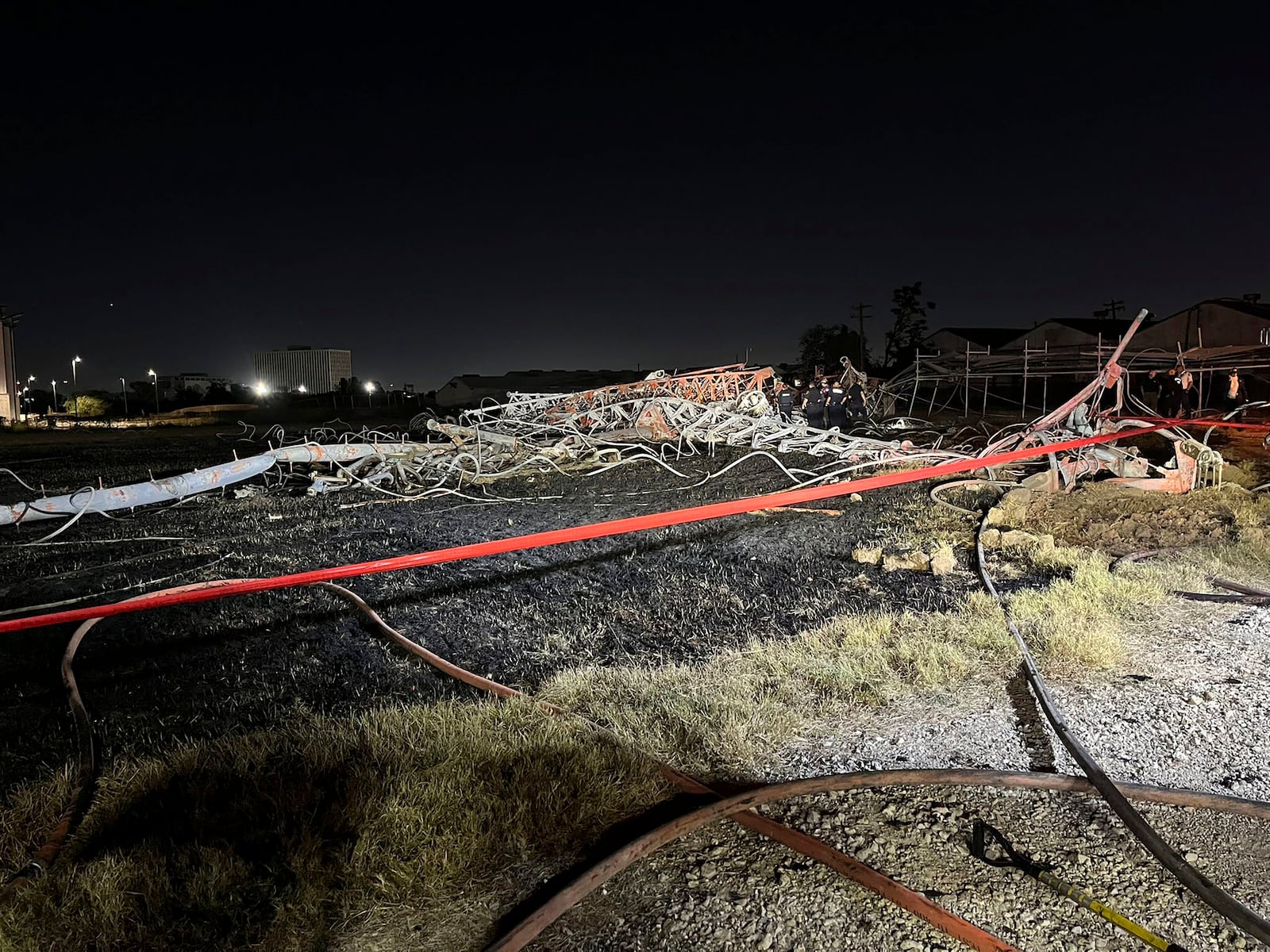 This image provided by the Houston Fire Department shows the scene of a helicopter crash in the city's Second Ward, Sunday, Oct. 20, 2024. (Houston Fire Department via AP)