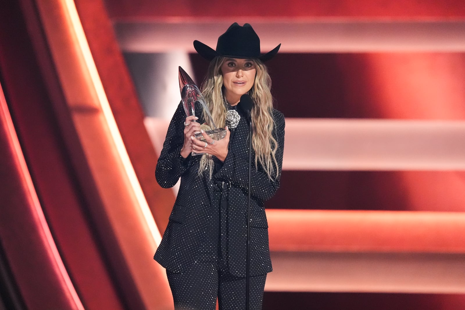 Lainey Wilson accepts the award for female vocalist of the year during the 58th Annual CMA Awards on Wednesday, Nov. 20, 2024, at Bridgestone Arena in Nashville, Tenn. (AP Photo/George Walker IV)