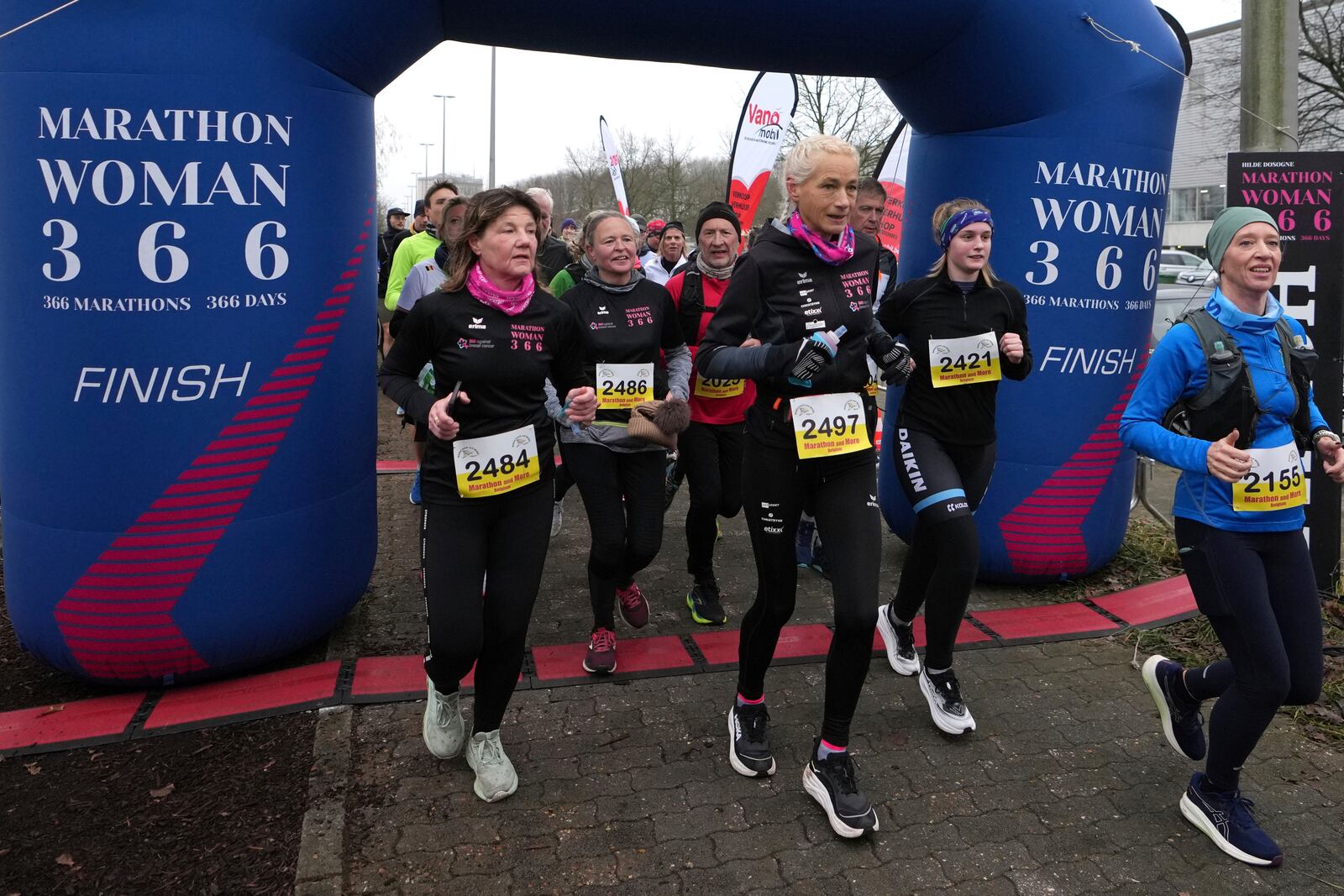 Belgian ultra runner Hilde Dosogne, center, runs during her 366th consecutive marathon in Ghent, Belgium, Tuesday, Dec. 31, 2024. (AP Photo/Virginia Mayo)