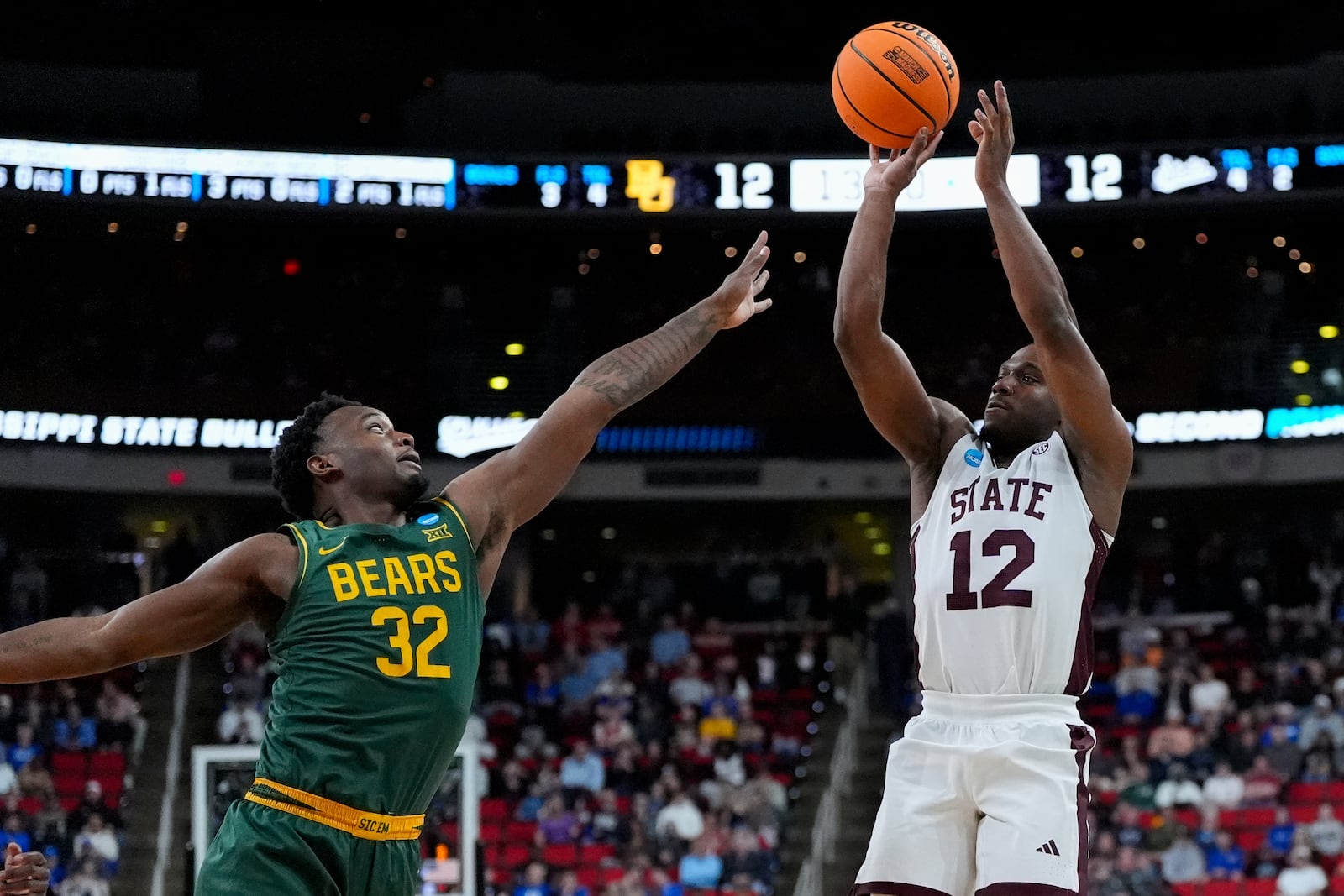 Mississippi State guard Josh Hubbard (12) shoots a three-point shot in front of Baylor guard Jalen Celestine (32) during the first half in the first round of the NCAA college basketball tournament, Friday, March 21, 2025, in Raleigh, N.C. (AP Photo/Stephanie Scarbrough)