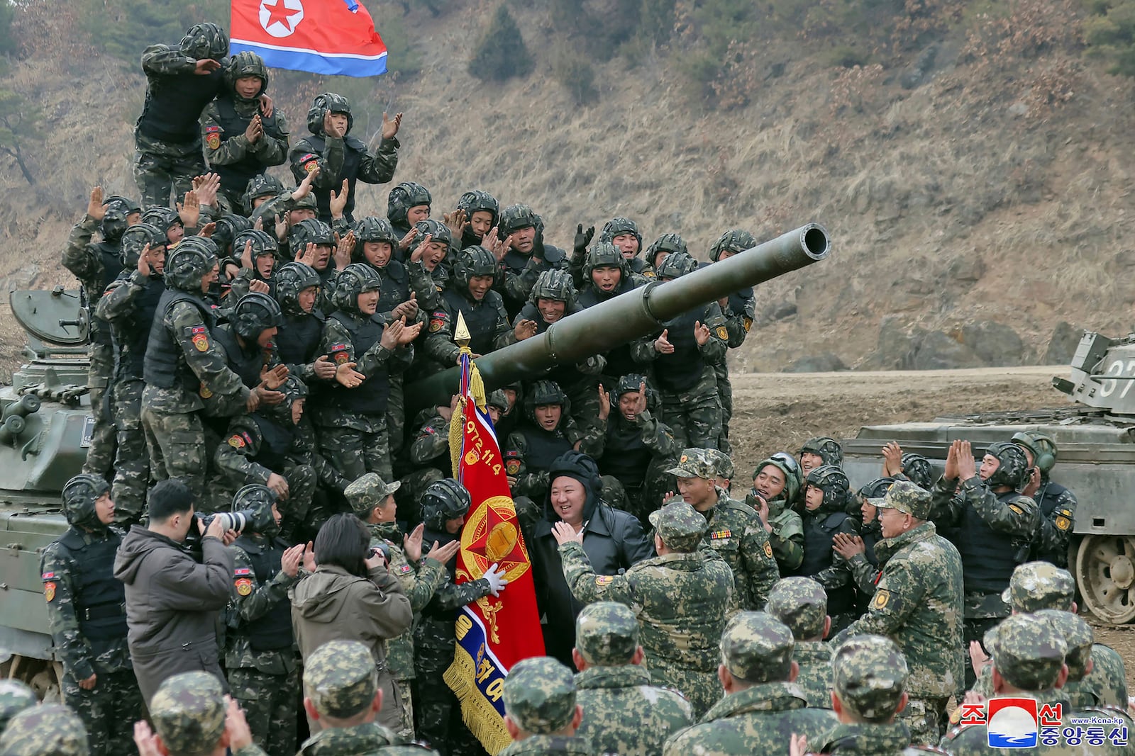 FILE - In this photo provided by the North Korean government, North Korean leader Kim Jong Un, center, meets soldiers who took part in a training in North Korea, on March 13, 2024. Independent journalists were not given access to cover the event depicted in this image distributed by the North Korean government. (Korean Central News Agency/Korea News Service via AP, File)