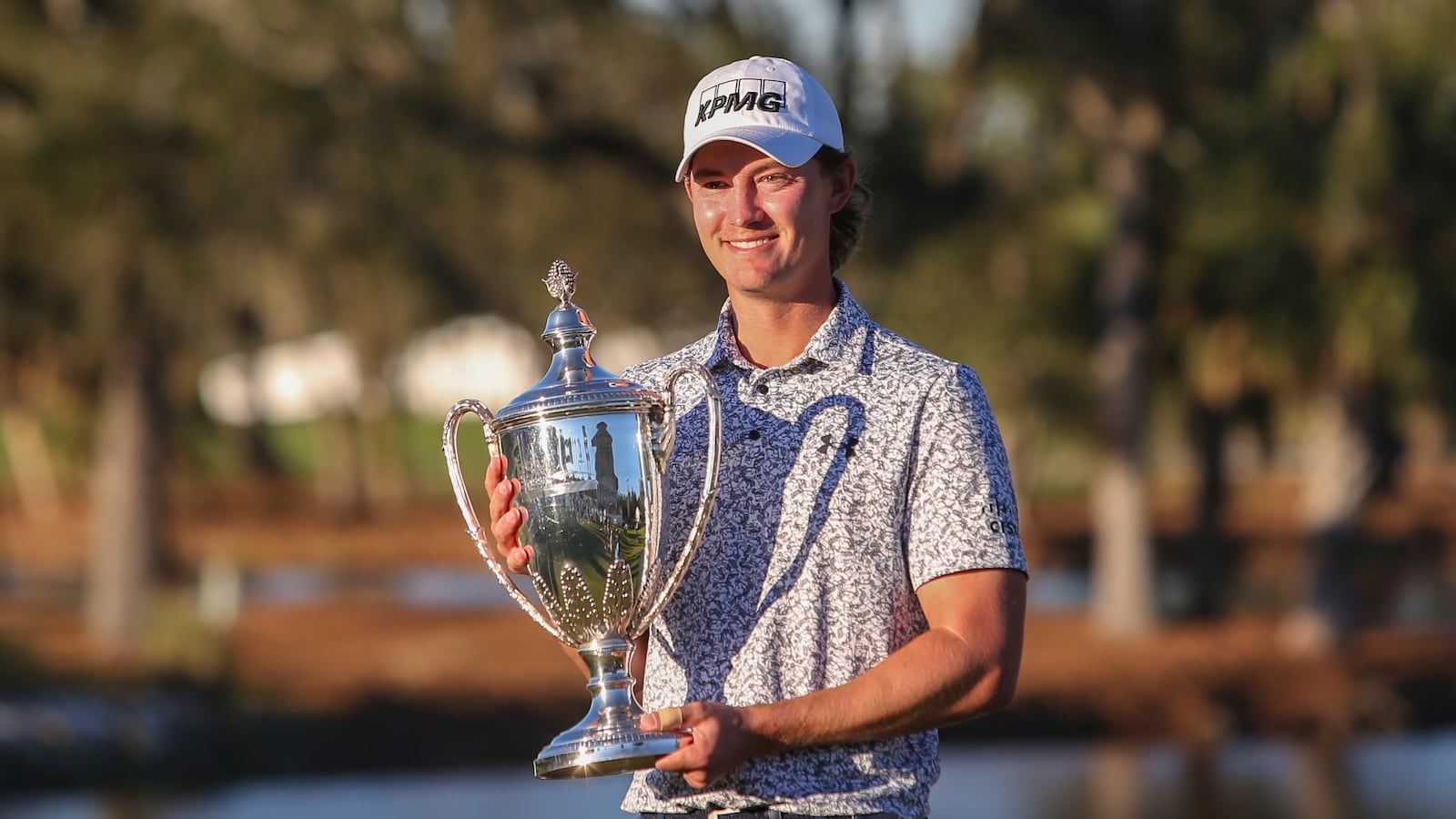 Maverick McNealy holds the trophy after the final round of the RSM Classic golf tournament, Sunday, Nov. 24, 2024, in St. Simons Island, Ga. (AP Photo/Gary McCullough)