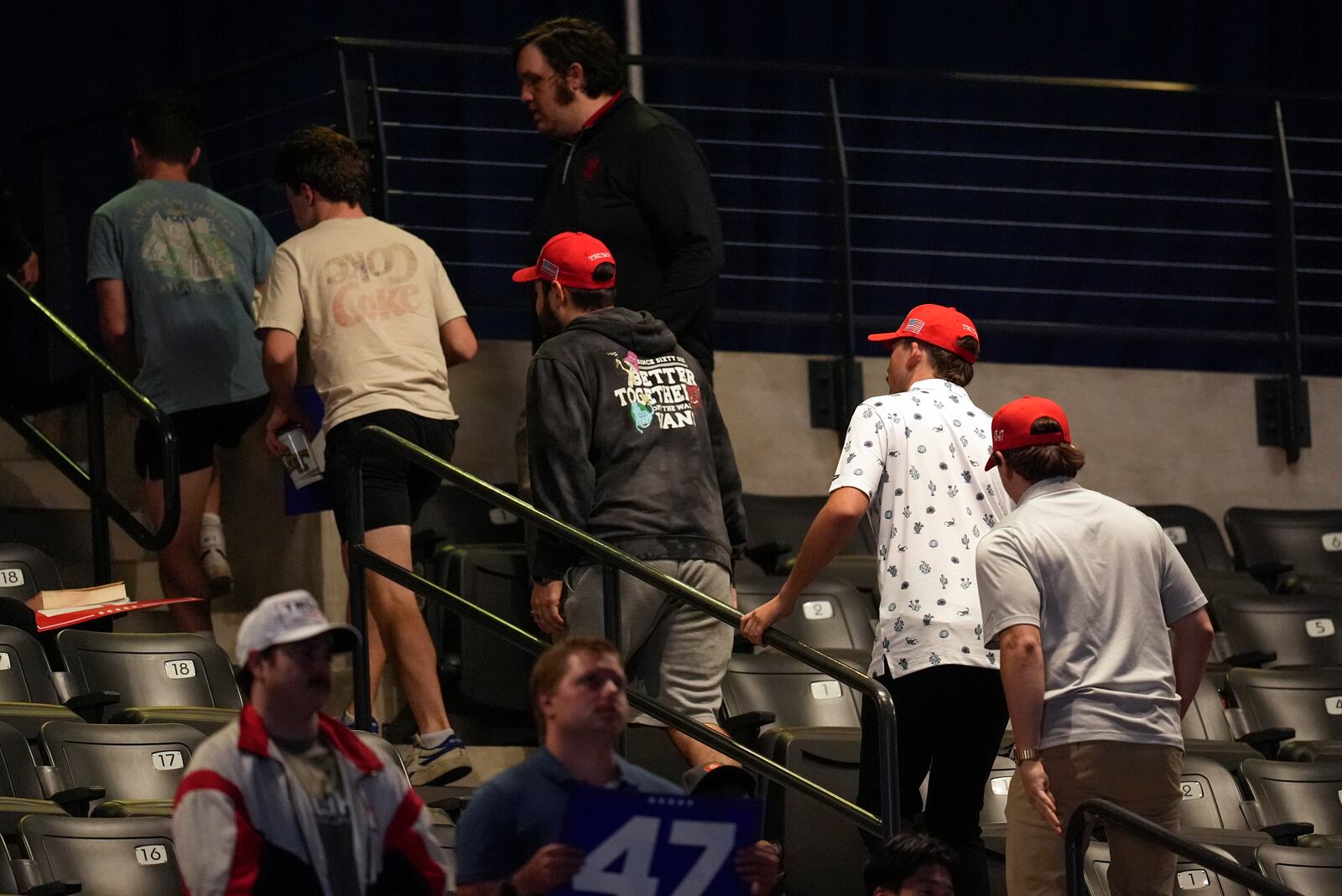 Supporters leave as Republican presidential nominee former President Donald Trump speaks at a campaign rally at McCamish Pavilion Monday, Oct. 28, 2024, in Atlanta. (AP Photo/Mike Stewart)