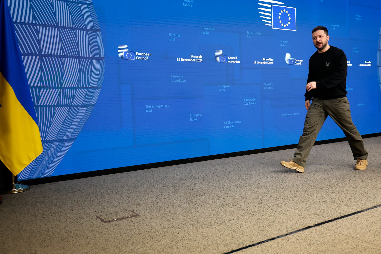 Ukraine's President Volodymyr Zelenskyy leaves the podium after addressing a media conference during an EU summit in Brussels, Thursday, Dec. 19, 2024. (AP Photo/Geert Vanden Wijngaert)