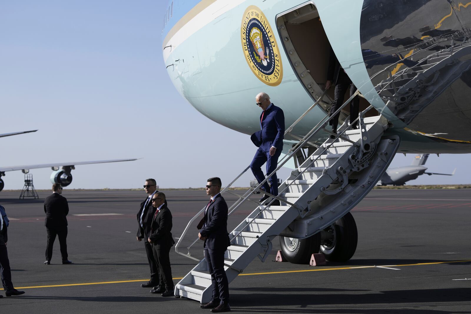 President Joe Biden walks from Air Force One at Amilcar Cabral international airport on Sal island, Cape Verde Monday, Dec. 2, 2024, en route to Angola as he makes his long-promised visit to Africa. (AP Photo/Ben Curtis)