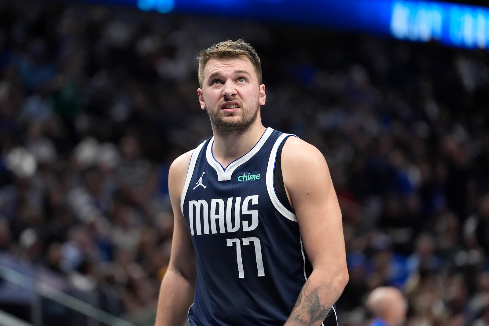 Dallas Mavericks guard Luka Doncic looks up from the floor during the first half of an NBA basketball game against the Phoenix Suns Friday, Nov. 8, 2024, in Dallas. (AP Photo/LM Otero)