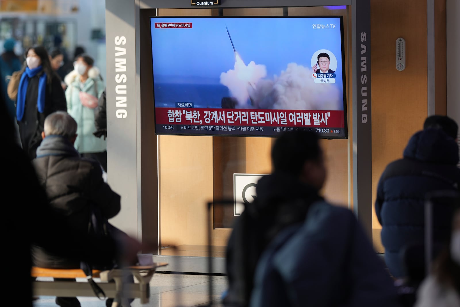 A TV screen shows a report of North Korea's missiles launch with file footage during a news program at the Seoul Railway Station in Seoul, South Korea, Tuesday, Jan. 14, 2025. (AP Photo/Lee Jin-man)