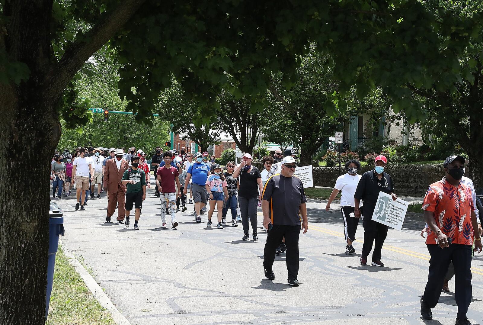 Members of the Clergy from several Springfield churches along with area residents and members of law enforcement participated in a six-mile Prayer March Sunday to show unity against racial injustice. The march started at the Southgate Baptist Church on South Center Blvd. and ended at the Cornerstone Baptist Church at the intersection of North Limestone and Rosscommon Drive. The marchers stopped at several churches along the parade route to pray. BILL LACKEY/STAFF