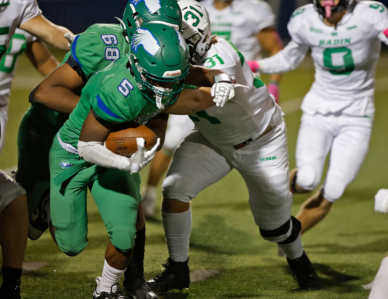 CJ's Aiden Lowery is tackled by Badin's Nick Rings. BILL LACKEY/STAFF