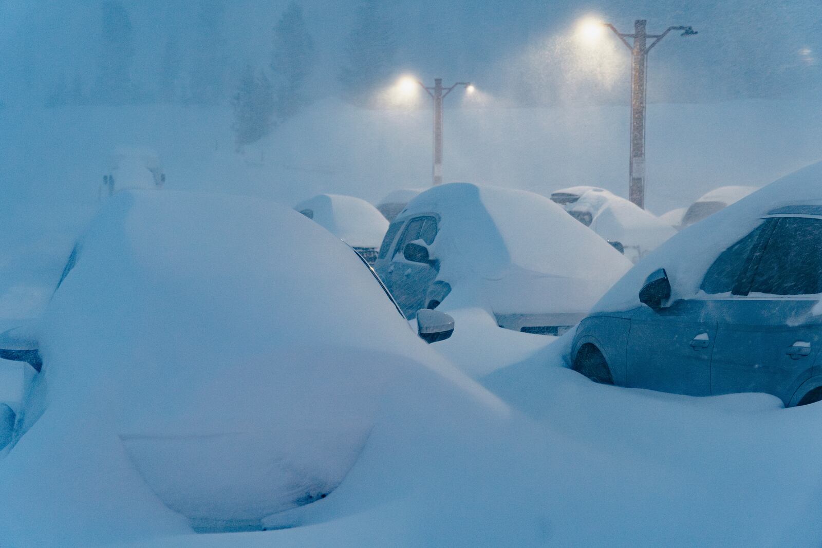 Snow covers vehicles at the Mammoth Mountain Ski Area Thursday, Feb. 13, 2025, in Mammoth Lakes, Calif. (Cody Mathison/Mammoth Mountain via AP)