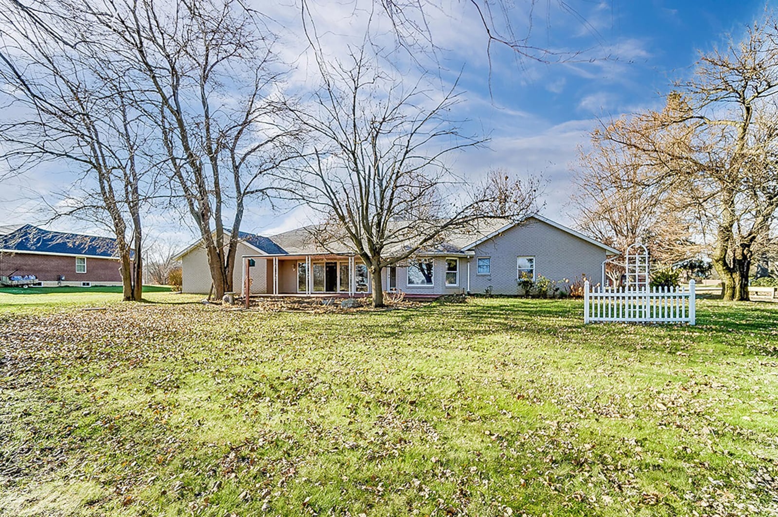 The rear of the home features a wood deck, recently refinished and partially covered. The large back yard features many mature trees and an open view due to no rear neighbors. CONTRIBUTED PHOTO