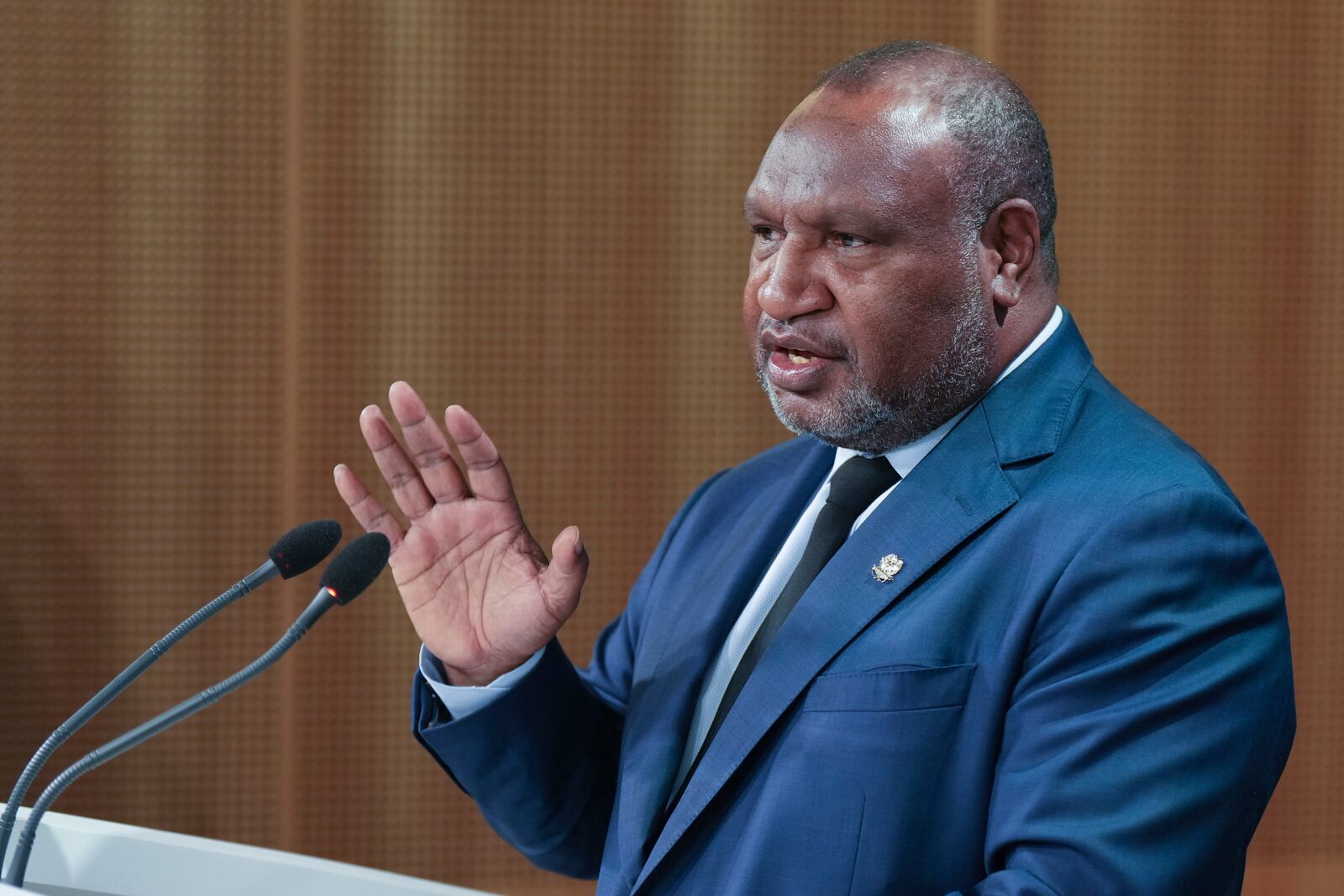 Papua New Guinea Prime Minister James Marape gestures during a press conference with Australian Prime Minister Anthony Albanese in Sydney, Australia, Thursday, Dec. 12, 2024. (AP Photo/Mark Baker)